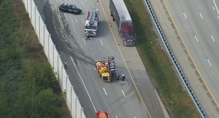 Cement truck crashes, rolls to its side on M-59 near Rochester Road