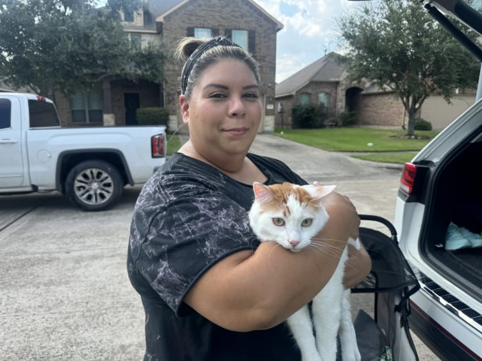 Family reunites with cat after evacuating home during Deer Park pipeline fire